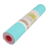 rolled TPE yoga mat showing compact portable design