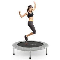 person exercising on 36 inch mini rebounder trampoline