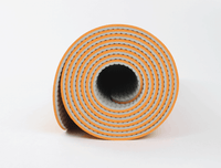 rolled TPE yoga mat showing compact portable design