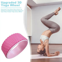 yoga pose using a massage wheel for flexibility and support