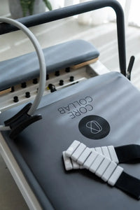 Close-up of Pilates reformer carriage and footbar